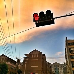 Low angle view of road sign against sky