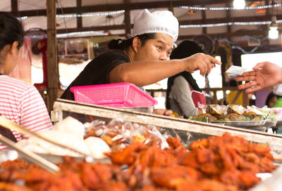 Group of people having food in restaurant