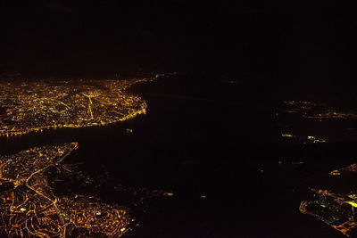 Aerial view of illuminated trees against sky at night