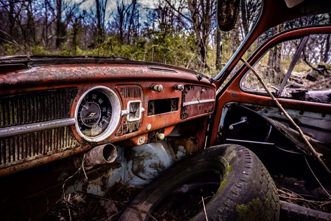 transportation, land vehicle, mode of transport, car, abandoned, old, tree, obsolete, wheel, old-fashioned, travel, damaged, rusty, run-down, deterioration, vintage car, rail transportation, tire, railroad track, part of