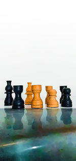 Close-up of chess board against white background