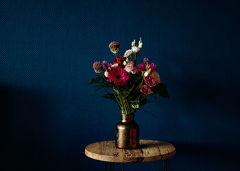 Close-up of flower vase against black background