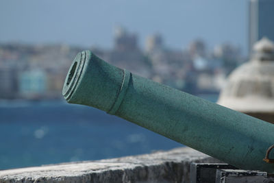 Close-up of metal against sky