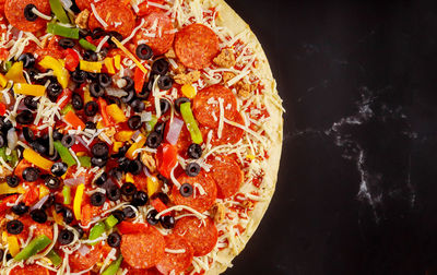 High angle view of pizza against black background