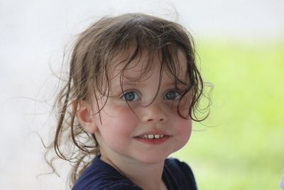 Close-up portrait of cute girl outdoors