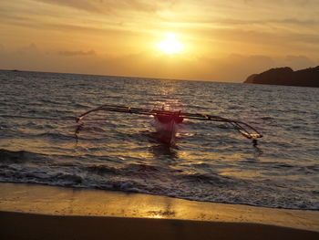 Scenic view of sea at sunset