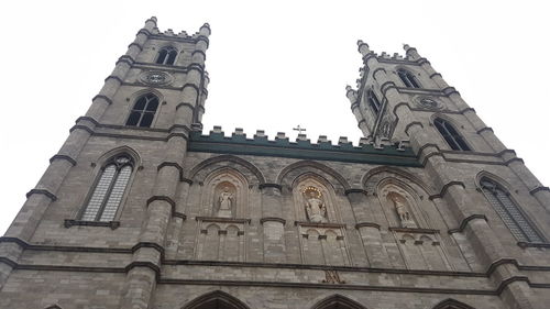 Low angle view of clock tower against sky