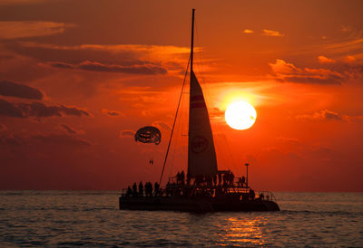 Silhouette of boats at sunset