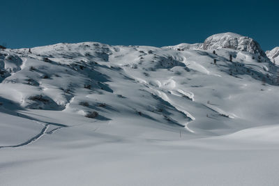 Scenic view of snow mountains against sky