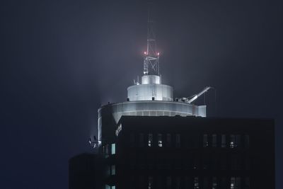 Low angle view of tower at night