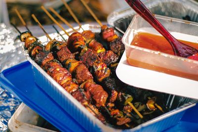 High angle view of meat on barbecue grill