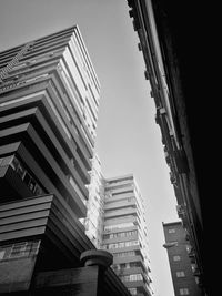 Low angle view of skyscrapers against clear sky