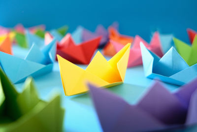 Close-up of multi colored paper on table