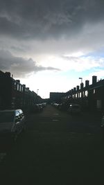 Road against cloudy sky at sunset