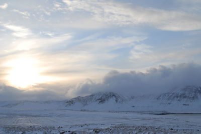 Scenic view of snow mountains against sky