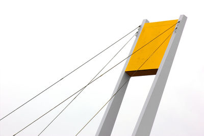 Low angle view of cables against clear sky
