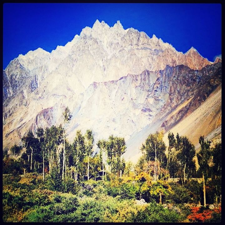 mountain, transfer print, clear sky, tranquility, tranquil scene, mountain range, beauty in nature, scenics, landscape, tree, auto post production filter, nature, blue, non-urban scene, rock formation, panoramic, rocky mountains, sunlight, plant, idyllic