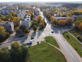 High angle view of street amidst trees in city