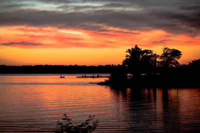 Scenic view of dramatic sky over lake