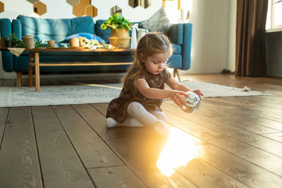 Cute girl playing at home