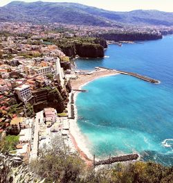 High angle view of sea and city