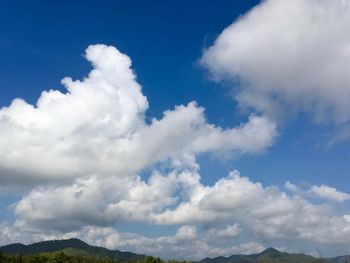 Scenic view of clouds over blue sky