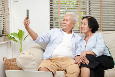 Man and woman sitting with text