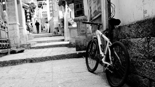 Bicycle parked in front of building