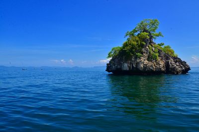 Scenic view of sea against blue sky