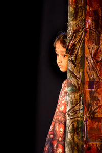 Portrait of beautiful young woman looking away