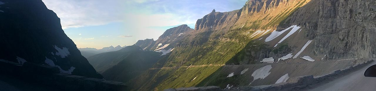 mountain, sky, road, cloud - sky, mountain range, nature, scenics, building exterior, cloud, panoramic, built structure, beauty in nature, rock formation, tranquility, sunlight, tranquil scene, landscape, architecture, outdoors, day