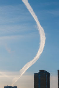 Low angle view of vapor trails in sky