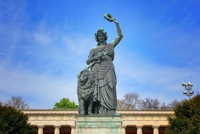 Low angle view of statue against sky