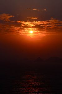 Scenic view of sea against romantic sky at sunset