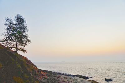 Scenic view of sea against sky at sunset