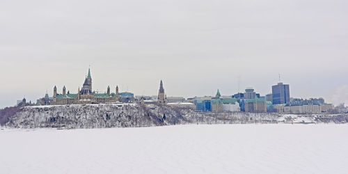 View of buildings in city during winter