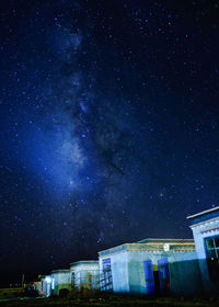 Low angle view of illuminated building against sky