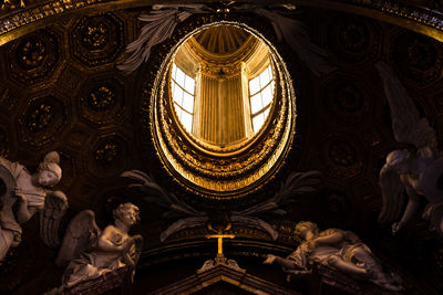 Low angle view of ornate ceiling of a church in rome