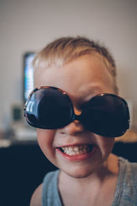 Close-up portrait of boy wearing sunglasses