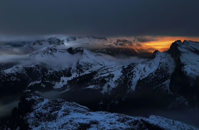 Scenic view of mountains against sky during winter