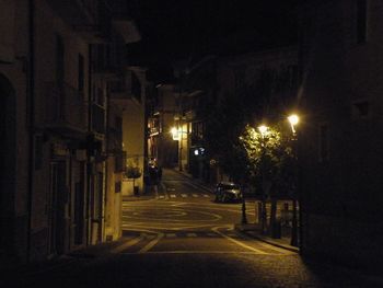 Illuminated street at night