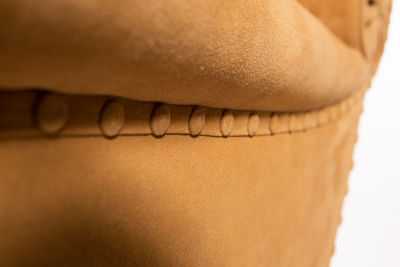 Close-up of woman against white background