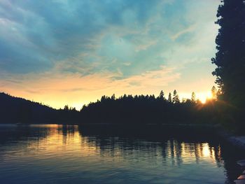 Scenic view of calm lake at sunset