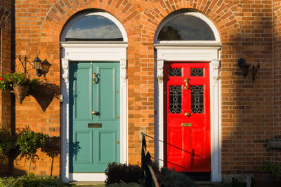 Two door entrances on the brick building