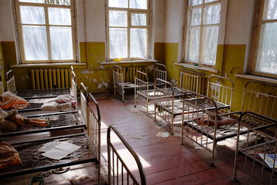 High angle view of abandoned beds in room