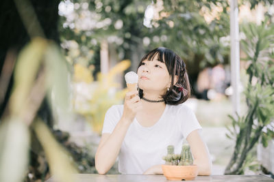 Portrait of woman holding ice cream