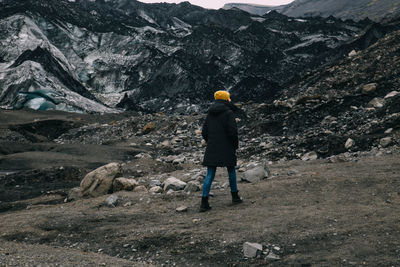 Full length rear view of man walking on mountain