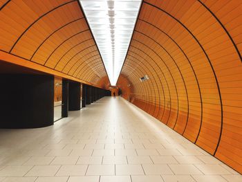 Walkway in illuminated tunnel