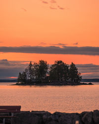 Scenic view of sea against romantic sky at sunset