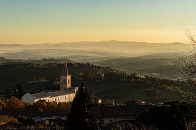 High angle view of buildings against sky at sunset